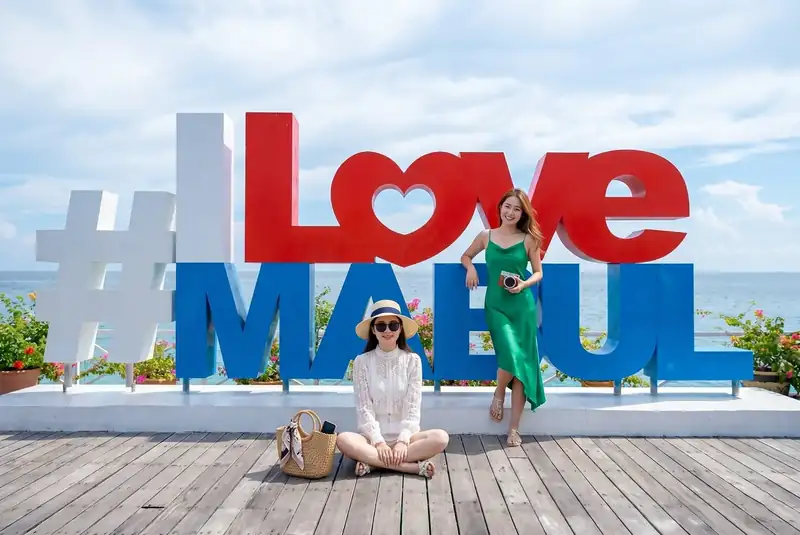 Iconic photo spot at the I Love Mabul sign on Mabul Island F-Lina Water Villa Resort