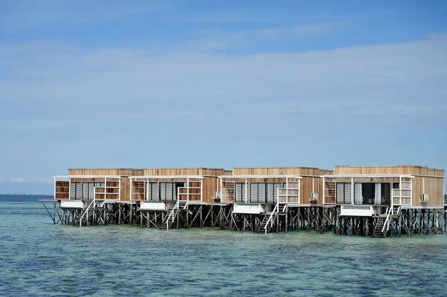 Scenic view of the wooden overwater chalets at the resort F-Lina Water Villa Resort