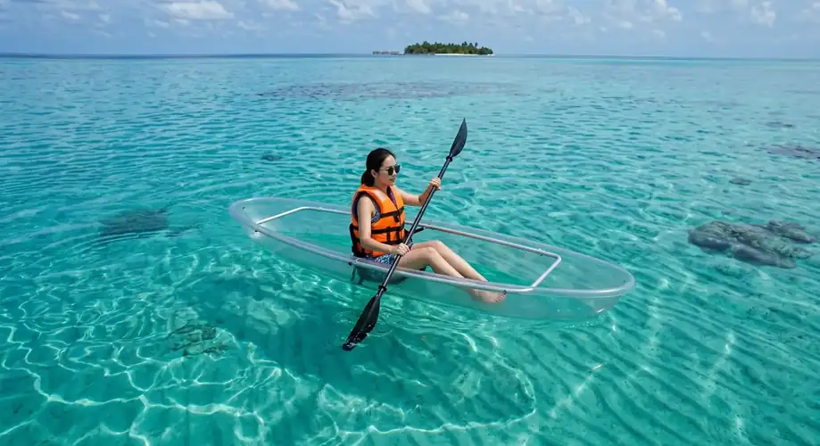 Guest enjoying a kayaking session in Semporna F-Lina Water Villa Resort