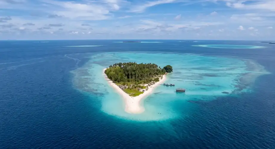 Pristine beach and crystal clear water at Sibuan Island F-Lina Water Villa Resort